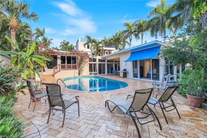 lush landscaped paver pool area