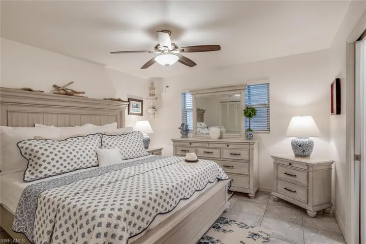 Tiled bedroom with ceiling fan