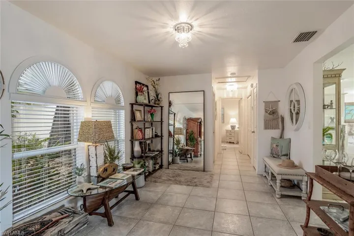 Corridor with light tile patterned floors
