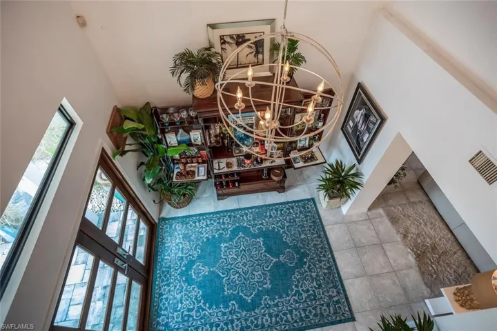 Room details with french doors and an inviting chandelier