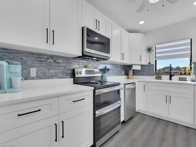 Beautiful New Kitchen w/ Quart Counters, Tile Backsplash, Stainless Steel Appliances (double oven), & Lots of Cabinet Space.