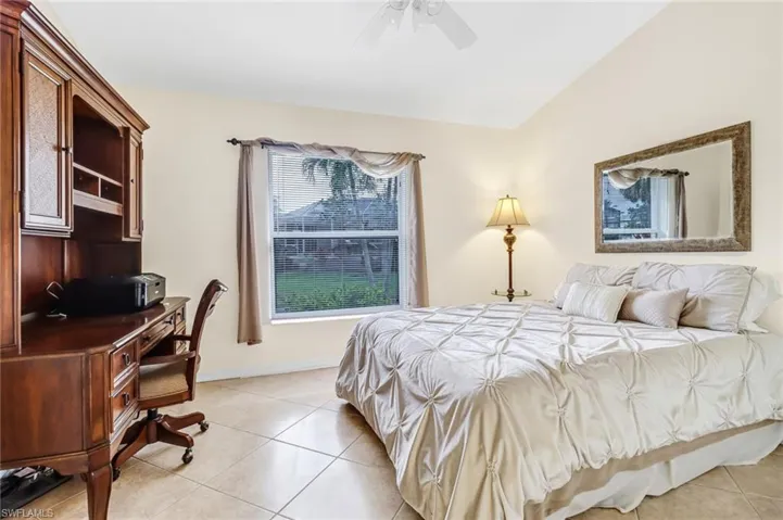 Tiled bedroom with ceiling fan
