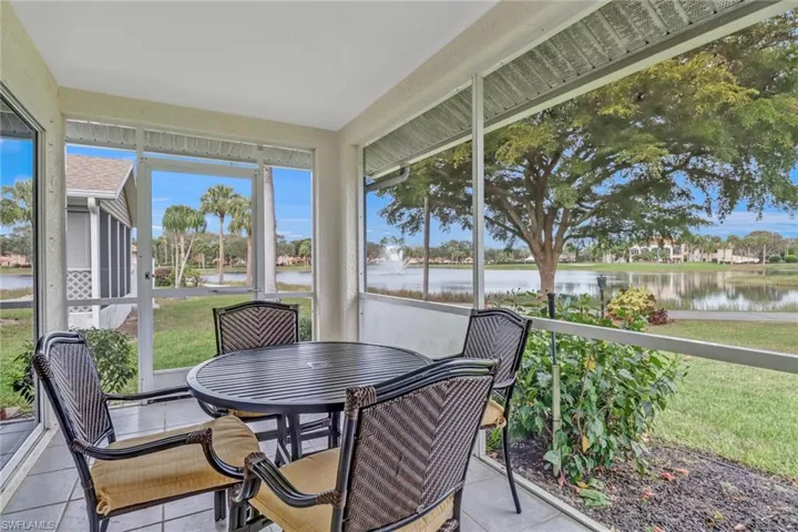 Sunroom / solarium featuring a water view and a wealth of natural light
