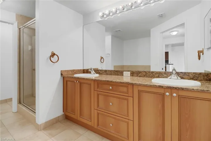 double sink vanity with shower and soaking tub