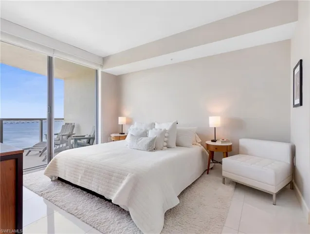 bedroom with floor to ceiling windows