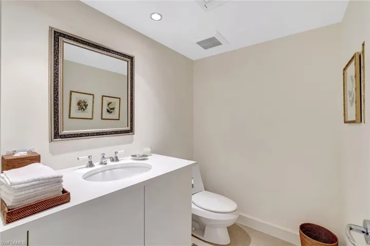 Bathroom featuring vanity, light tile patterned floors, and recessed lighting