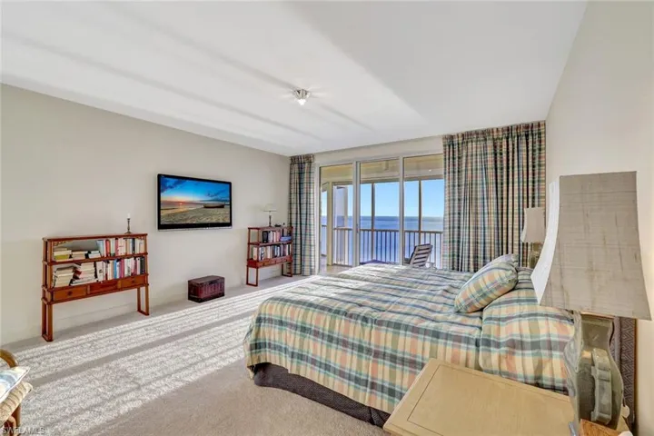 Bedroom with carpet flooring and access to exterior