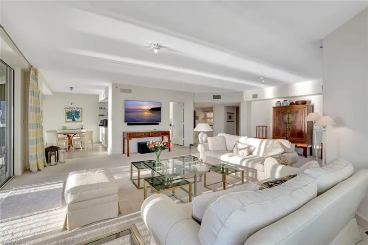 Living area featuring carpet and a fireplace