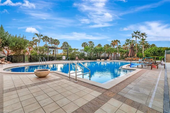 Community pool with a patio area