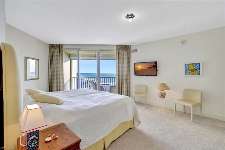 Bedroom featuring access to exterior and carpet floors