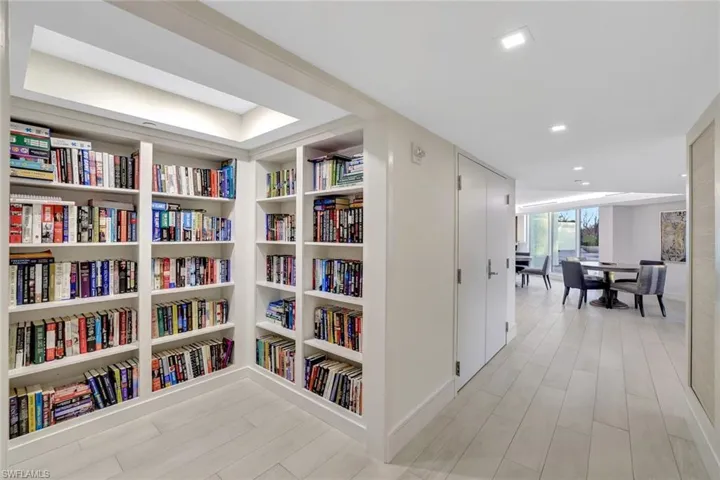 Hallway featuring light wood-style flooring and recessed lighting