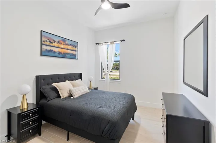 Bedroom featuring light wood-type flooring and a ceiling fan