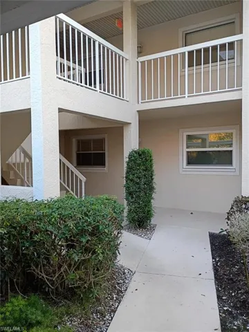 View of exterior entry featuring stucco siding