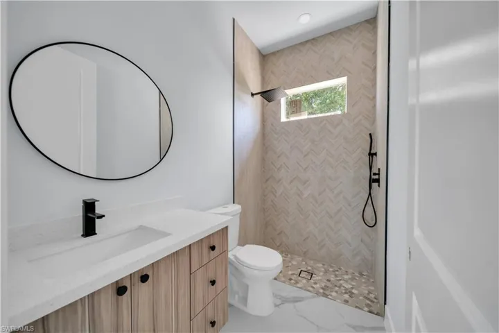 Bathroom featuring vanity and walk in shower