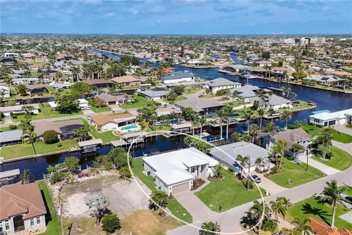 Aerial perspective of suburban area with a nearby body of water