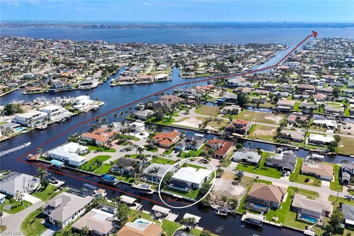 Aerial perspective of suburban area with a nearby body of water
