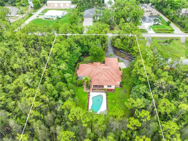 Aerial overview of property's location featuring property parcel outlined and a pool area