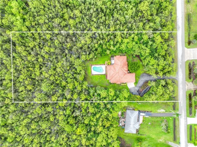 Aerial overview of property's location featuring property parcel outlined