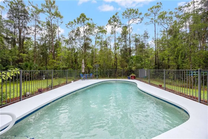 View of swimming pool featuring a fenced backyard