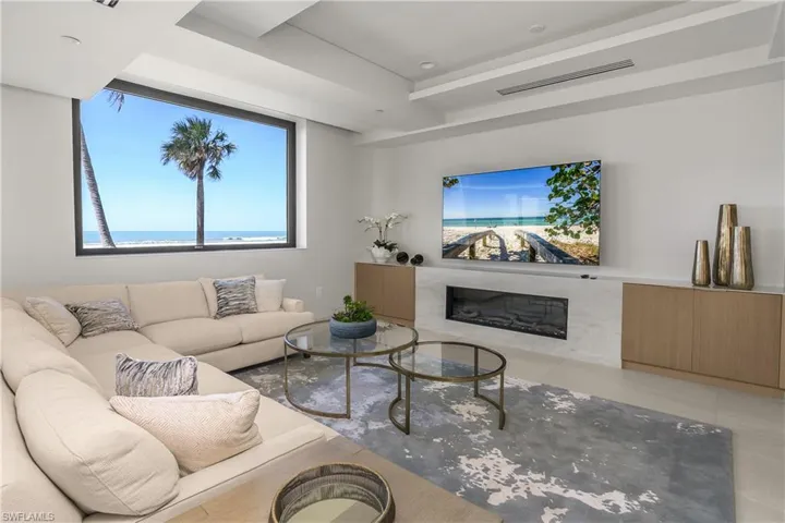 Community room featuring a premium fireplace and large screen television