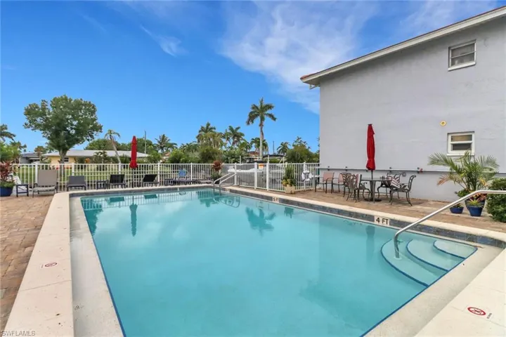 Community pool with a patio area