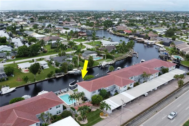 Aerial perspective of suburban area with a large body of water