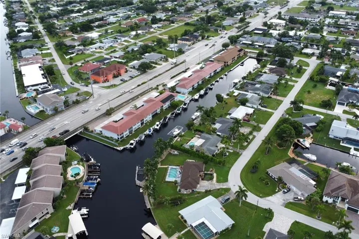 View of property location with nearby suburban area and a large body of water