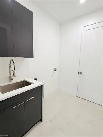 Laundry area featuring washer hookup, cabinet space, and hookup for an electric dryer