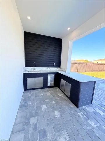 View of patio / terrace featuring an outdoor kitchen