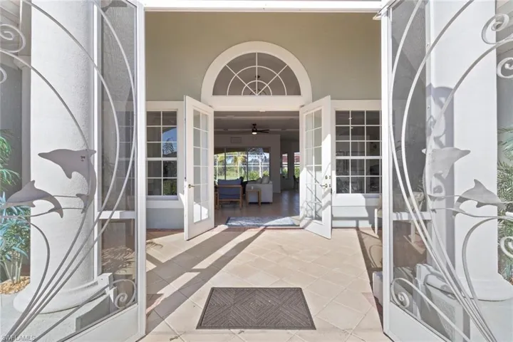 View of exterior entry featuring a patio, stucco siding, and french doors