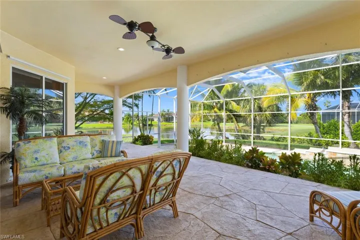 Sunroom / solarium featuring a water view