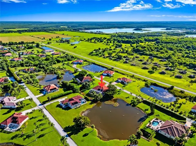 Aerial view of residential area featuring a large body of water