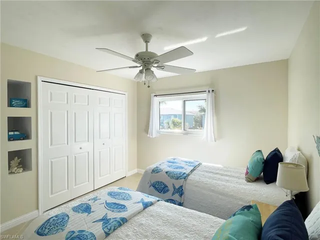 Bedroom with a closet and ceiling fan