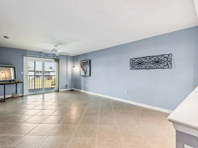 Spare room with light tile patterned flooring and ceiling fan