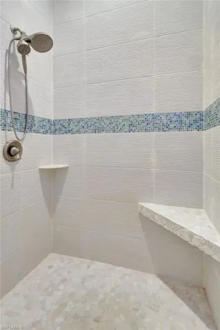 Bathroom featuring a tile shower