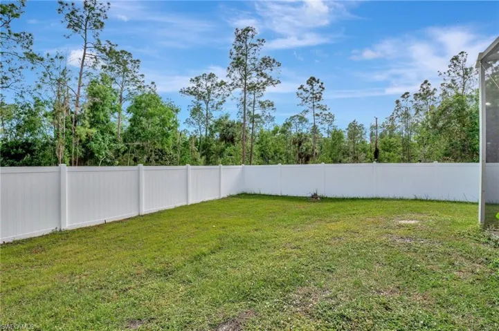 View of fenced in area of the vast yard