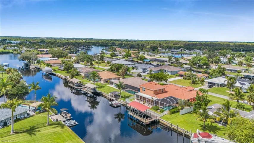 Aerial view of residential area featuring a large body of water