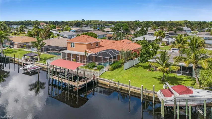 Aerial view of residential area featuring a large body of water