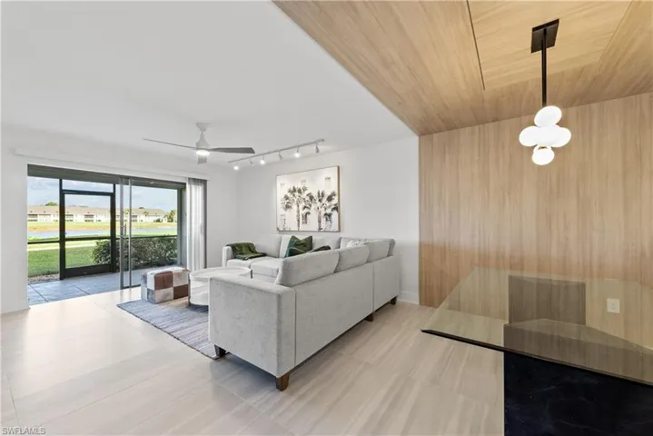 Living area featuring wooden ceiling and ceiling fan