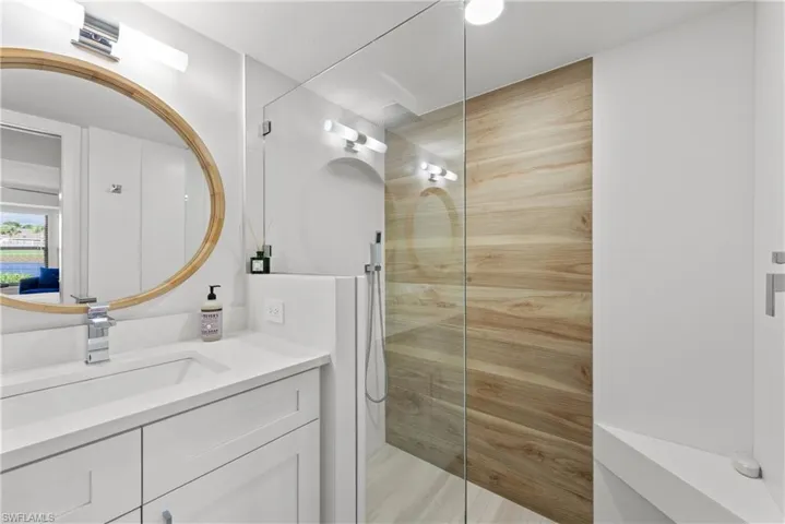 Bathroom featuring vanity and a walk in shower