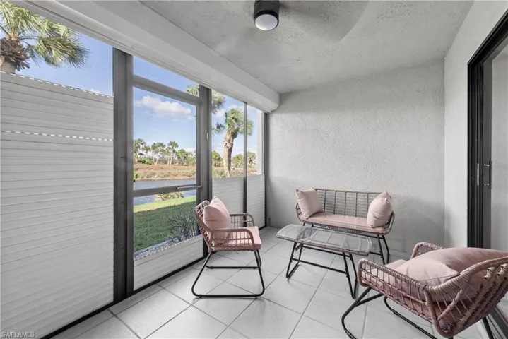 Sunroom with a water view