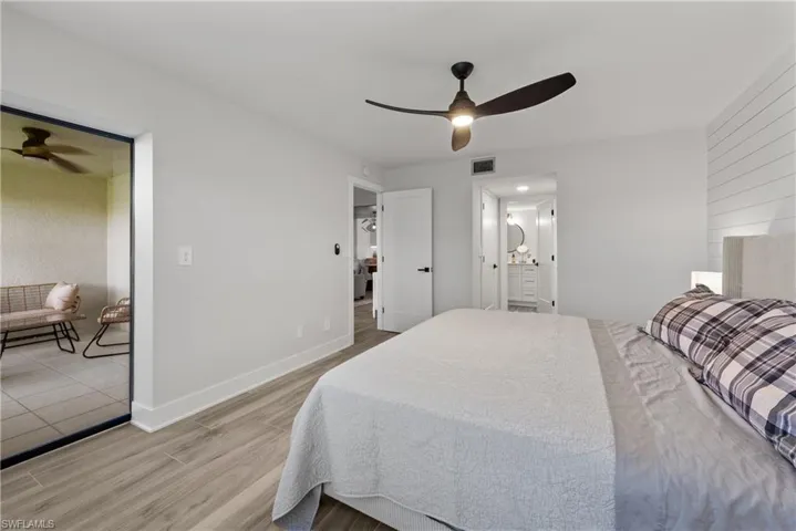 Bedroom with light wood-type flooring and a ceiling fan