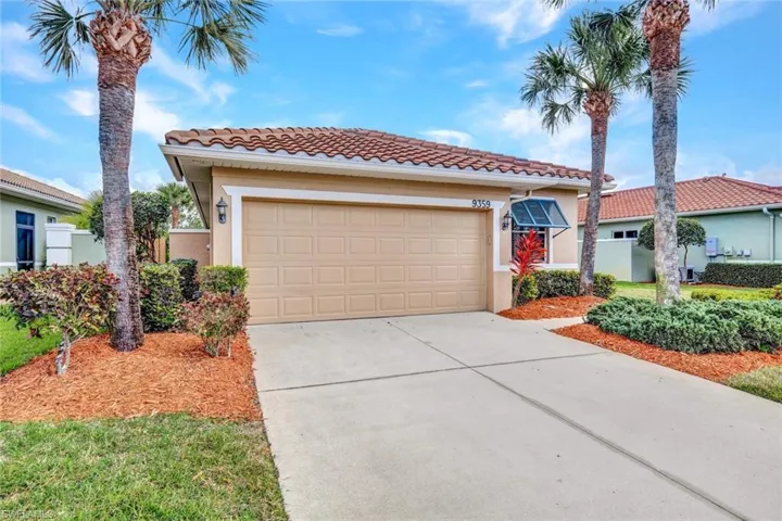 Mediterranean / spanish home featuring stucco siding, concrete driveway, a tiled roof, and an attached garage
