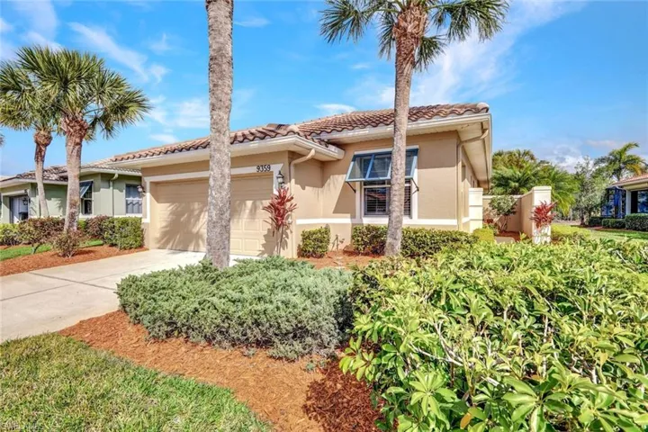 Mediterranean / spanish home with an attached garage, stucco siding, concrete driveway, and a tiled roof