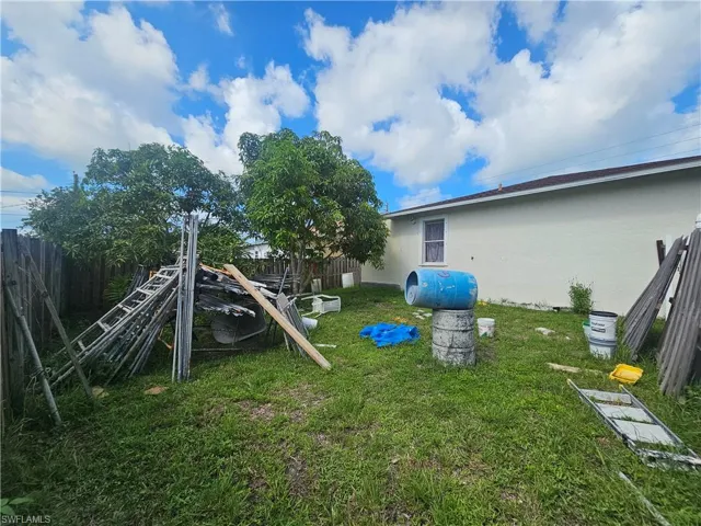 View of fenced backyard
