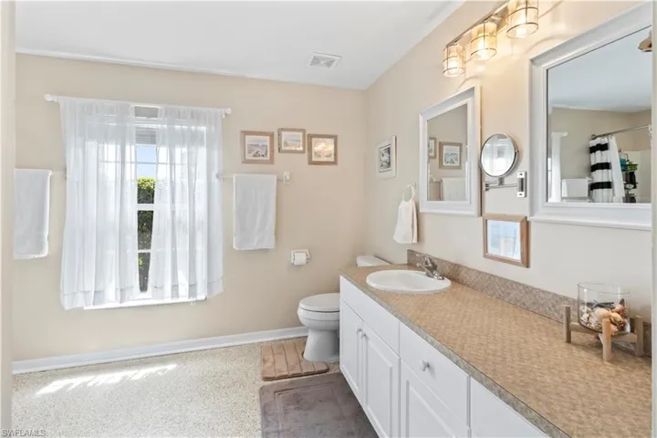 Full bathroom with vanity and a shower with curtain