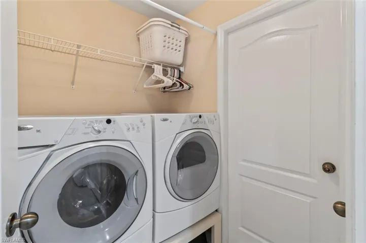 Washroom with washing machine and dryer