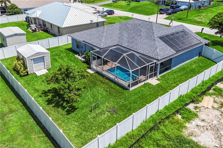 View of pool with a fenced backyard, a lanai, and a sunroom