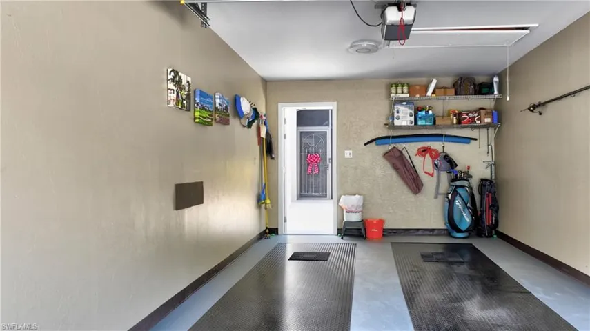 Garage featuring a garage door opener