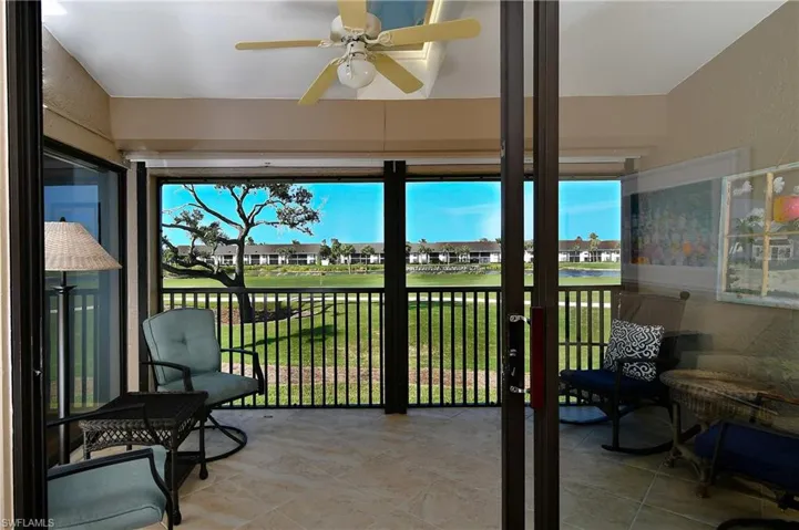 Sunroom / solarium featuring ceiling fan